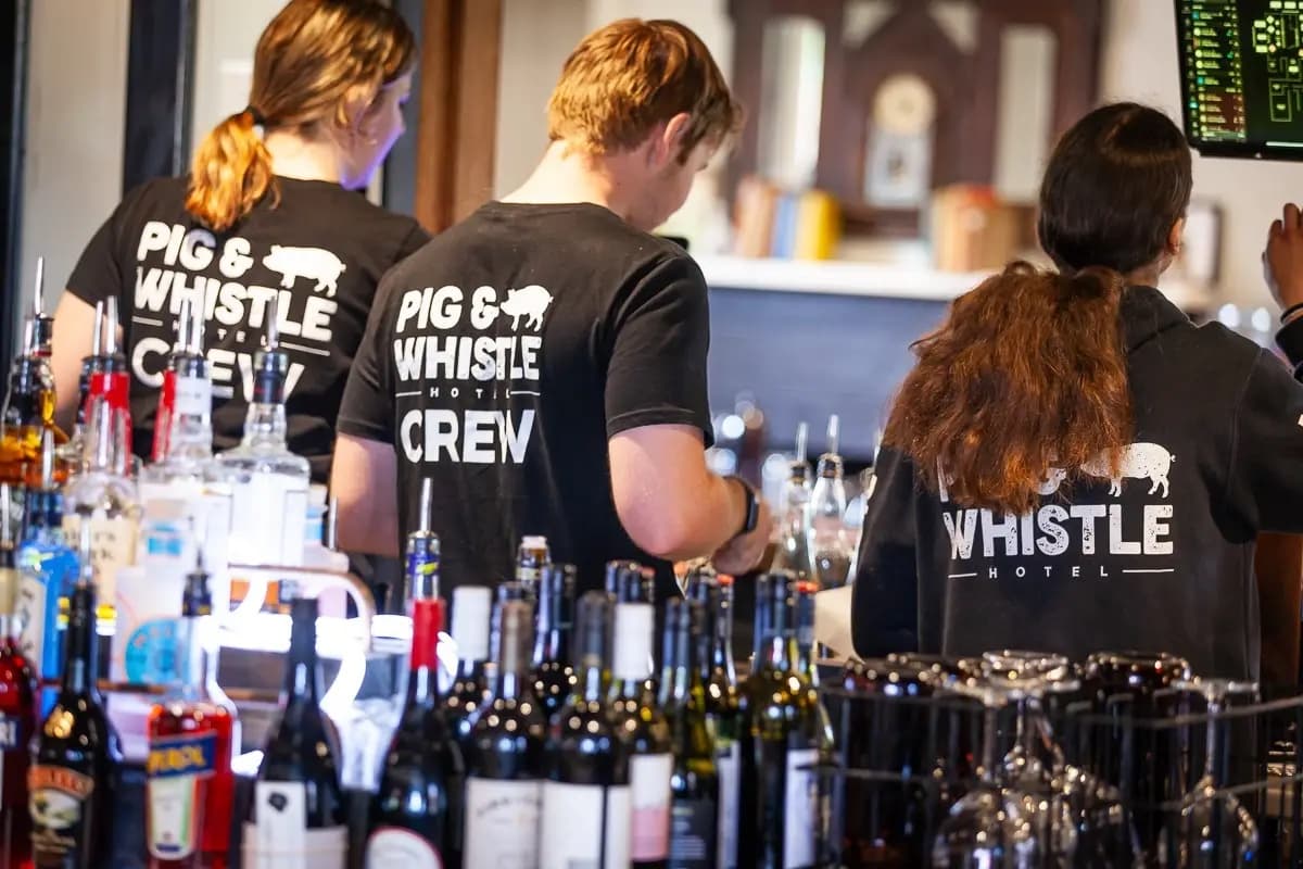 The Pig & Whistle crew working behind the bar